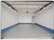 A spacious, clean garage with epoxy flooring and white walls provides ample space at 11332 Westbranch Pkwy, Davidson, NC 28036