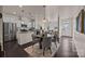 Well-lit kitchen and dining space with modern finishes, stainless steel appliances, and a functional layout at 11332 Westbranch Pkwy, Davidson, NC 28036
