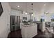 Modern kitchen with stainless steel appliances, granite countertops, and ample cabinet space at 11332 Westbranch Pkwy, Davidson, NC 28036