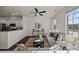 Stylish living room featuring modern decor, a ceiling fan, and lots of natural light at 11332 Westbranch Pkwy, Davidson, NC 28036