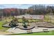 Community playground featuring swings, slides, and a tennis court in background at 11332 Westbranch Pkwy, Davidson, NC 28036