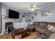 Cozy living room featuring a fireplace, wood floors, and comfortable seating at 114 Tr Foster Rd, Kings Mountain, NC 28086