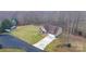 An elevated shot captures a house with a two-car garage, a lawn, and two trailers parked near the house at 1263 Waterford Dr, Hickory, NC 28602