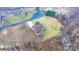 Aerial view of a house and yard in a wooded neighborhood in autumn at 1263 Waterford Dr, Hickory, NC 28602