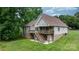 View of home's back deck with staircase to the ground in a large, grassy yard at 1263 Waterford Dr, Hickory, NC 28602