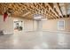Unfinished basement featuring high ceilings, exposed beams, and visible drum set at 1263 Waterford Dr, Hickory, NC 28602