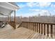 A wood deck with railings overlooks a wooded area and blue skies at 1263 Waterford Dr, Hickory, NC 28602