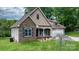 Charming home featuring a combination of stone and shingle siding with an attached two-car garage at 1263 Waterford Dr, Hickory, NC 28602