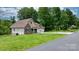 Charming two-story home featuring stone and shingle siding, an attached two-car garage, and a lush lawn at 1263 Waterford Dr, Hickory, NC 28602