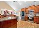 Spacious kitchen showcasing stainless steel appliances, a granite countertop, and custom wood cabinetry at 1263 Waterford Dr, Hickory, NC 28602