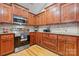 Elegant kitchen showcasing granite countertops, stainless steel appliances, and custom wood cabinets at 1263 Waterford Dr, Hickory, NC 28602
