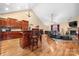 Open floor plan featuring a spacious living room with vaulted ceilings and a stone fireplace at 1263 Waterford Dr, Hickory, NC 28602