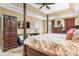 Comfortable main bedroom featuring tray ceiling, four poster bed, seating area, and natural light at 1263 Waterford Dr, Hickory, NC 28602