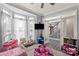 bedroom with hardwood floors, a ceiling fan, a television and access to foyer at 12836 Harvest Time Ct, Charlotte, NC 28278