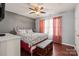 Charming bedroom features hardwood floors, natural light, and a cozy atmosphere at 12836 Harvest Time Ct, Charlotte, NC 28278