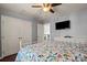 Bright bedroom featuring hardwood floors, neutral wall color, and double door closet at 12836 Harvest Time Ct, Charlotte, NC 28278