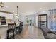 Spacious kitchen features an island with bar seating, stainless appliances, and ample lighting at 12836 Harvest Time Ct, Charlotte, NC 28278