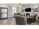 Cozy living room features a fireplace, modern decor, and comfortable seating at 12836 Harvest Time Ct, Charlotte, NC 28278