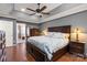 Main bedroom boasts tray ceiling, hardwood floors, and ensuite bathroom at 12836 Harvest Time Ct, Charlotte, NC 28278
