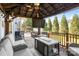 Relaxing outdoor patio with a ceiling fan and a full outdoor kitchen area at 12836 Harvest Time Ct, Charlotte, NC 28278