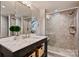 Modern bathroom featuring marble countertops and a glass enclosed shower at 138 Scofield Rd, Charlotte, NC 28209