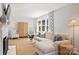 Bright living room featuring a fireplace, modern furniture, and a large window with elegant curtains at 138 Scofield Rd, Charlotte, NC 28209