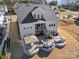 Expansive backyard featuring a gazebo, a fire pit surrounded by comfortable seating, and an outdoor grill area at 14230 Morningate St, Huntersville, NC 28078