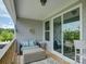 Cozy covered balcony with comfortable seating and a view of the outdoors at 14230 Morningate St, Huntersville, NC 28078