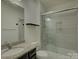 Bathroom featuring granite countertop, shower, and modern sliding door at 14230 Morningate St, Huntersville, NC 28078