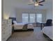 Bright bedroom featuring two beds, natural light, and ceiling fan at 14230 Morningate St, Huntersville, NC 28078