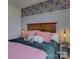 Charming bedroom with a wood headboard and decorative floral wallpaper at 14230 Morningate St, Huntersville, NC 28078