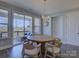 Dining area with natural light, a round table, and easy access to the covered porch at 14230 Morningate St, Huntersville, NC 28078