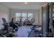 Bright home gym featuring multiple workout machines and natural light at 14230 Morningate St, Huntersville, NC 28078