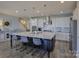 Open kitchen with a large center island, stainless steel appliances, and modern pendant lighting at 14230 Morningate St, Huntersville, NC 28078