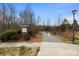 Entrance to Hector H. Henry Greenway is marked by a brick sign and paved trail at 1436 Astoria Nw Ln, Concord, NC 28027