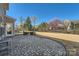 Backyard featuring a stone patio and a lush lawn, perfect for outdoor enjoyment at 15317 Colonial Park Dr, Huntersville, NC 28078