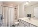 Bright bathroom featuring a shower and tub combination with a white vanity and modern fixtures at 15317 Colonial Park Dr, Huntersville, NC 28078