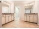 Modern bathroom with dual vanities, granite countertops, white cabinetry, tile floors, and neutral paint at 15317 Colonial Park Dr, Huntersville, NC 28078