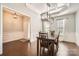 Formal dining room with coffered ceiling and contemporary chandelier at 15317 Colonial Park Dr, Huntersville, NC 28078