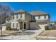 Traditional home with a two-car garage, landscaped front yard, and inviting entrance at 15317 Colonial Park Dr, Huntersville, NC 28078