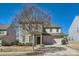 Traditional home with a two-car garage, landscaped front yard, and inviting entrance at 15317 Colonial Park Dr, Huntersville, NC 28078
