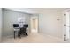 Home office with neutral walls, carpet, a window, and a desk with two monitors setup at 15317 Colonial Park Dr, Huntersville, NC 28078