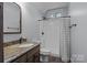 Bathroom featuring a shower with curtain, dark wood vanity with granite, and tiled floor at 1770 Cranwell Dr, Mt Ulla, NC 28125