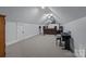Large bonus room with vaulted ceilings, projector, and a comfortable sitting area at 1770 Cranwell Dr, Mt Ulla, NC 28125