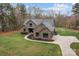 Sprawling single-Gathering home with brick and stone finishes, set on a large lot with meticulously maintained landscaping at 1770 Cranwell Dr, Mt Ulla, NC 28125