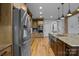Stainless steel refrigerator complements a modern kitchen design and layout at 1770 Cranwell Dr, Mt Ulla, NC 28125