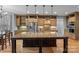 Spacious kitchen island with stone countertops, custom wood cabinetry, and modern pendant lighting at 1770 Cranwell Dr, Mt Ulla, NC 28125