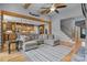 Open-concept living room with hardwood floors, wooden beams, and a view into the gourmet kitchen at 1770 Cranwell Dr, Mt Ulla, NC 28125