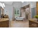 Elegant main bathroom featuring a soaking tub, tiled shower, and dual vanities at 1770 Cranwell Dr, Mt Ulla, NC 28125