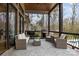 Inviting covered outdoor patio with comfortable wicker furniture and built-in grilling area at 1770 Cranwell Dr, Mt Ulla, NC 28125